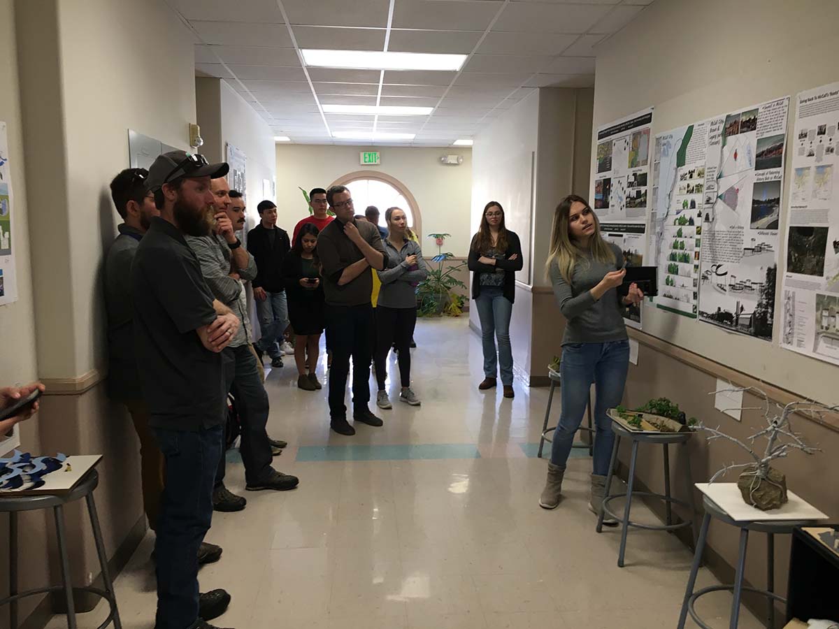 Students in hall for critique of work