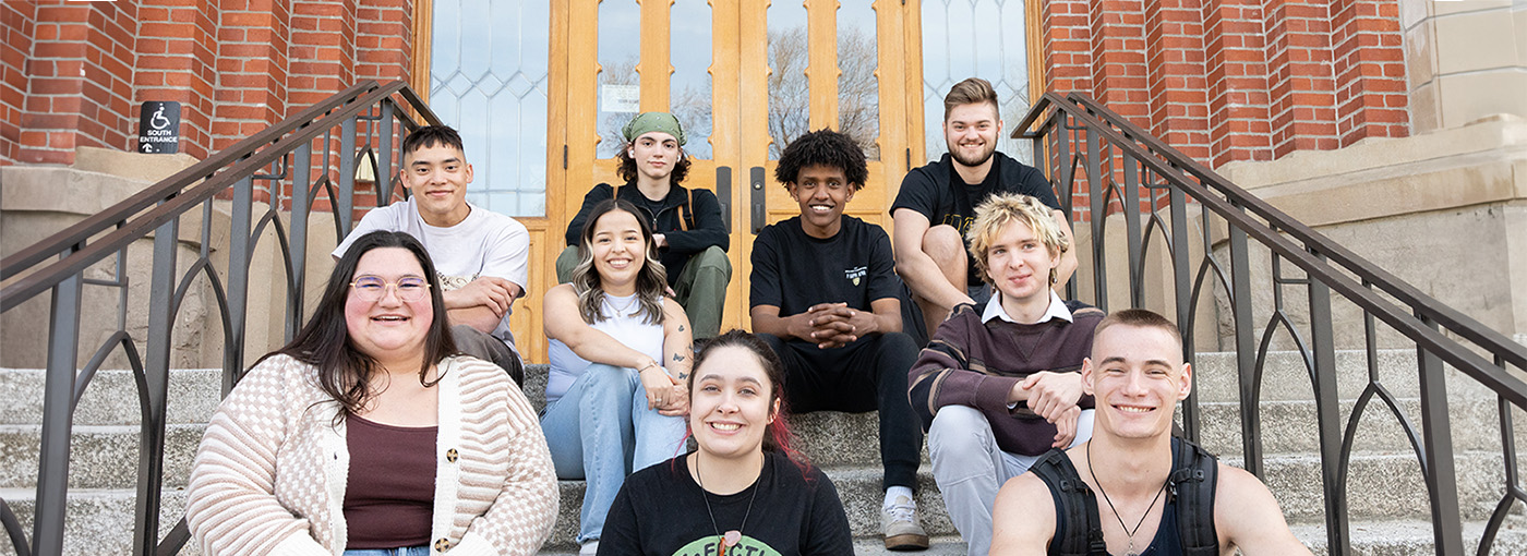 Students sitting in front of the Administration Building