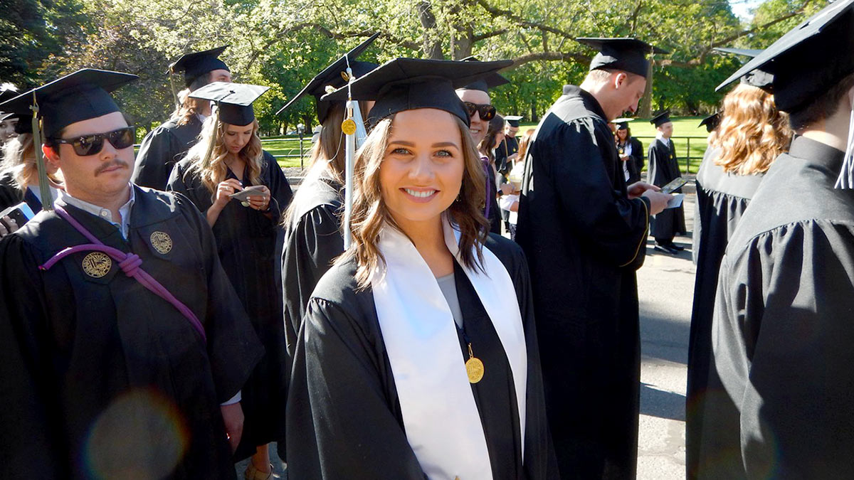 EHHS student dressed in commencement regalia