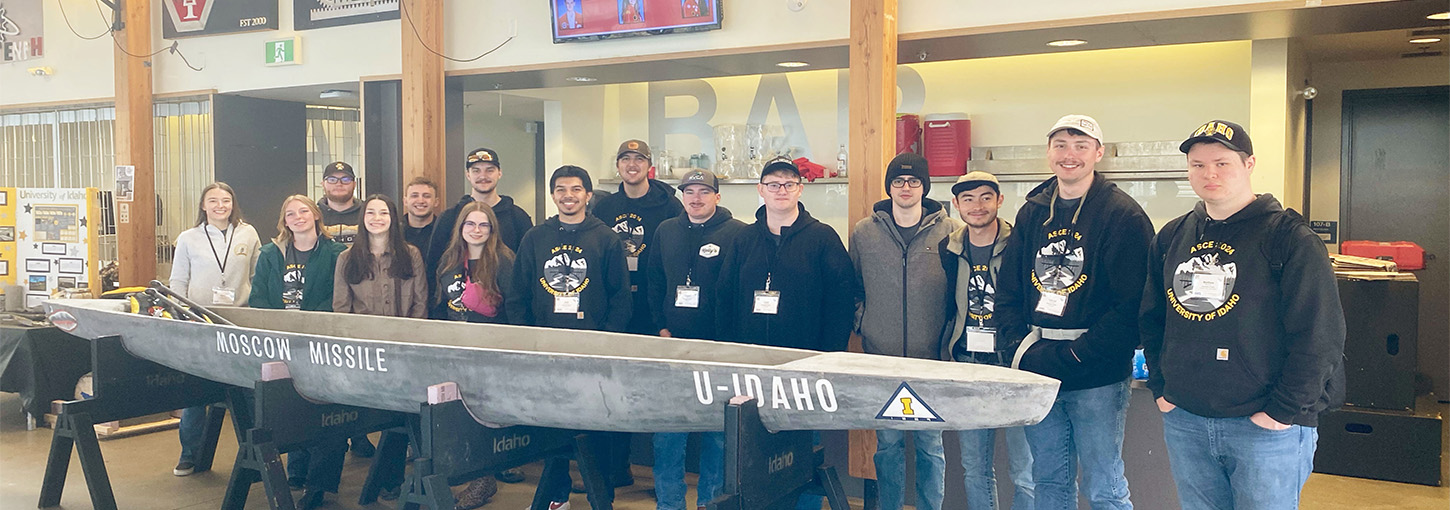 Club team members stand together in a room