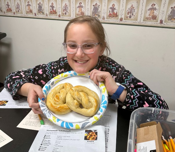 kid holding a pretzel 