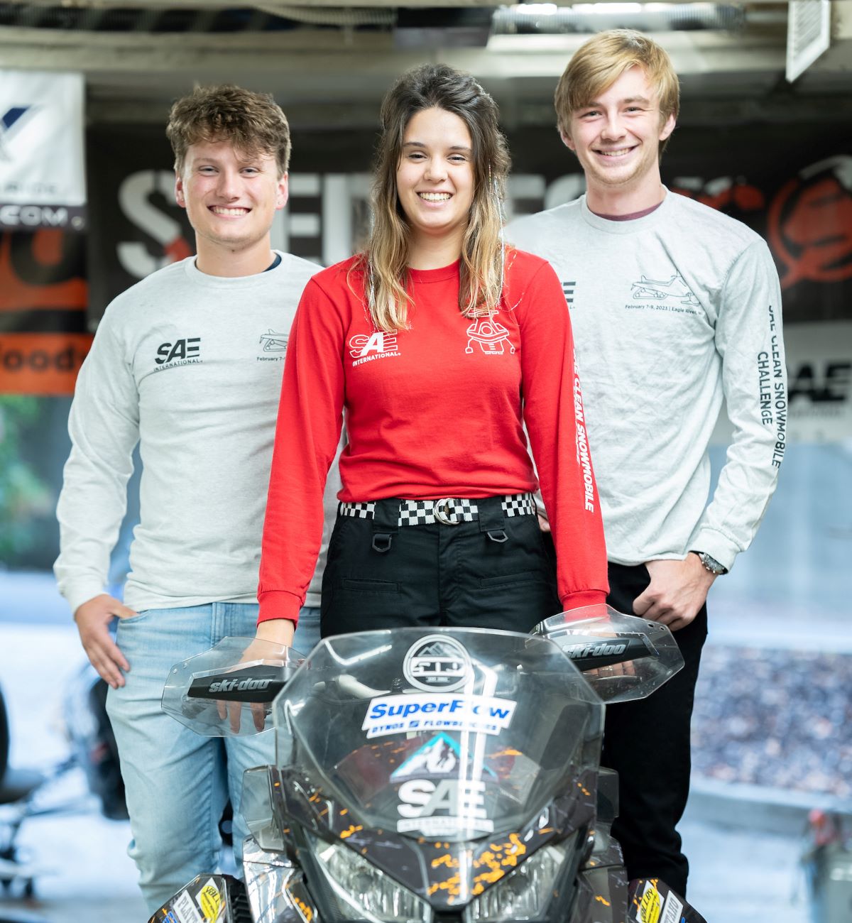 University of Idaho student McKenzie Reid with fellow students and snow mobile