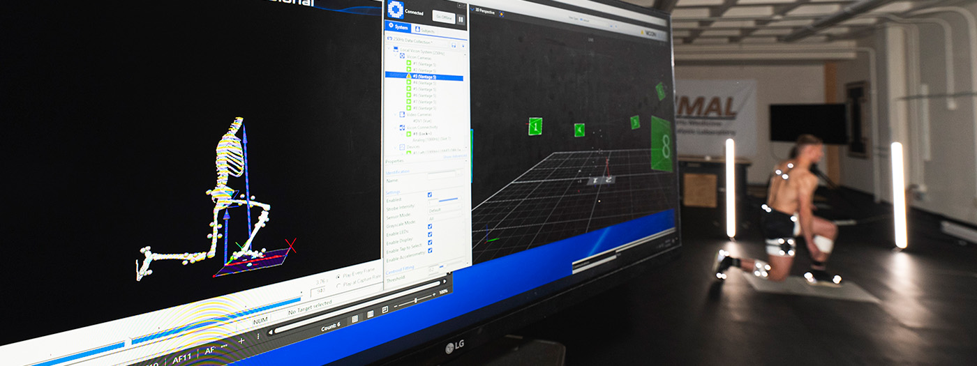 Skeleton on computer monitor on left and test subject on right.