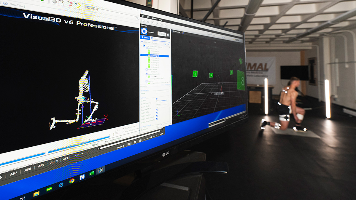 Skeleton on computer monitor on left and test subject on right.