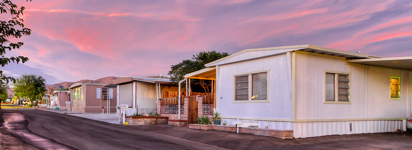 A photo of a trailer park with sunset.