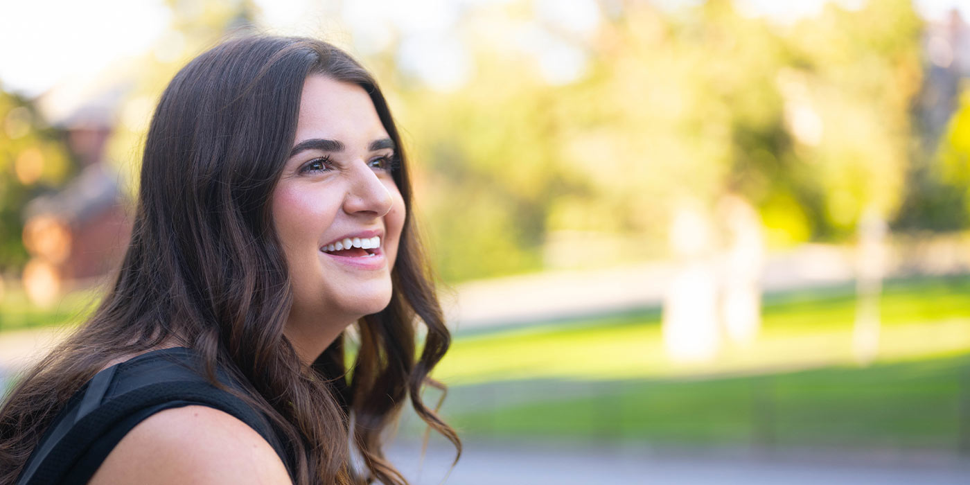 A side view of Alexandra Manolopoulos, smiling